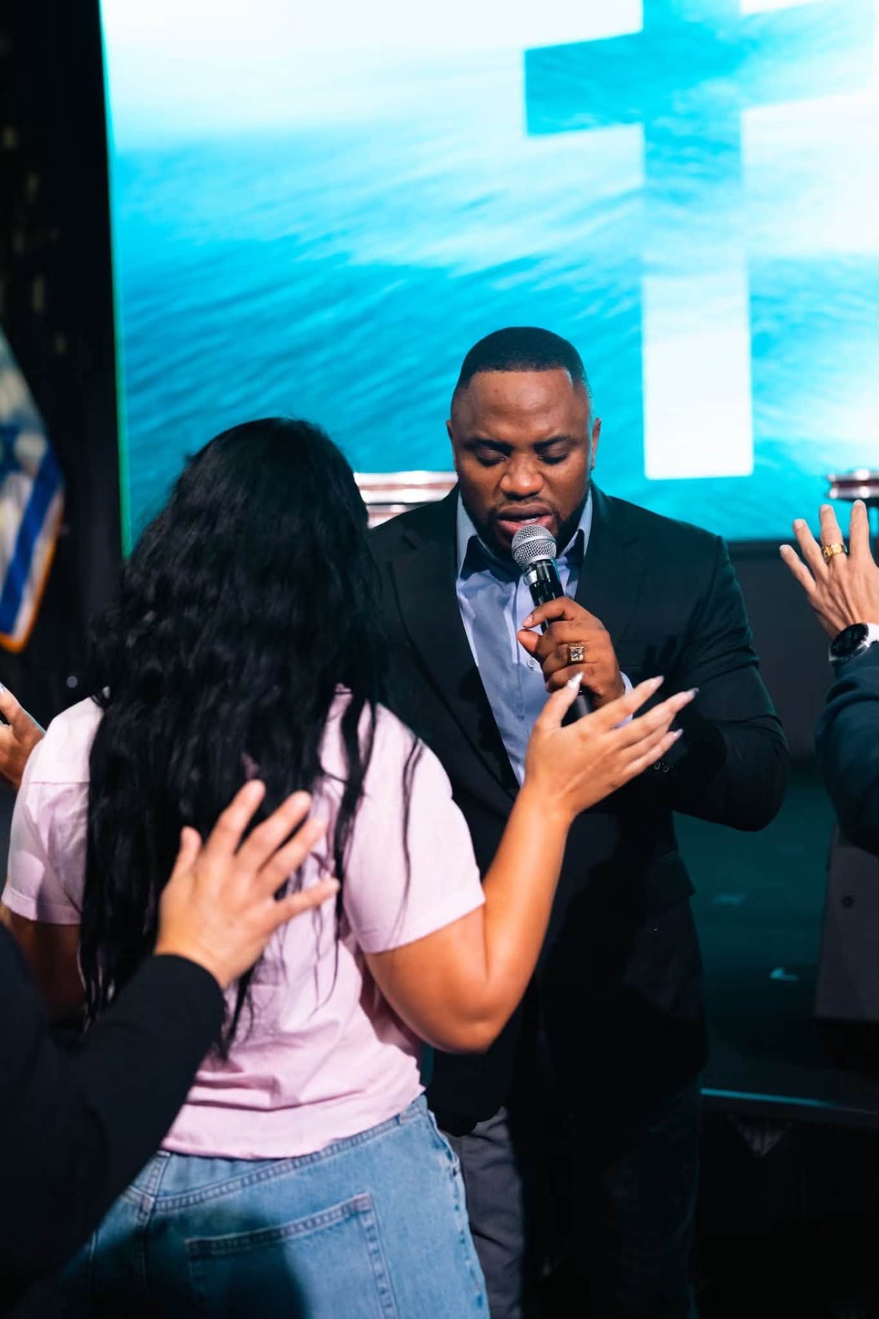 Prayer ministration during a revival service
