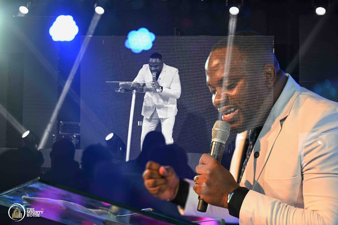 Apostle Sam Onyekachi ministering on stage at a revival gathering