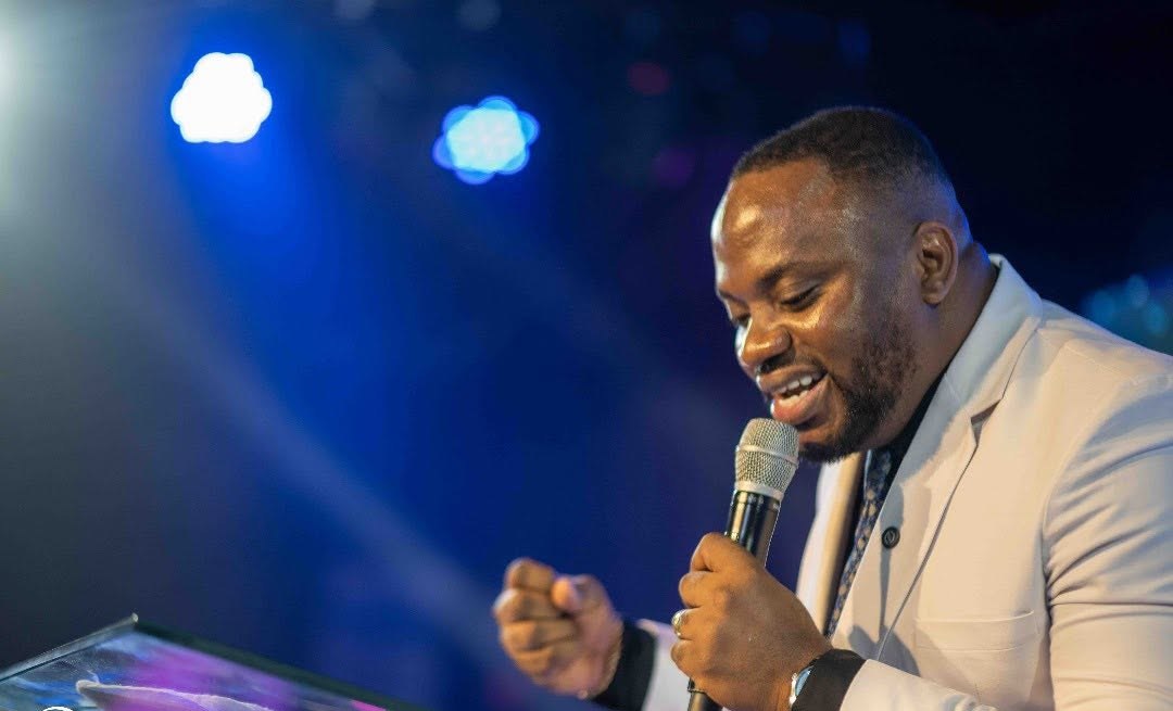 Apostle Sam Onyekachi preaching at an open-air crusade